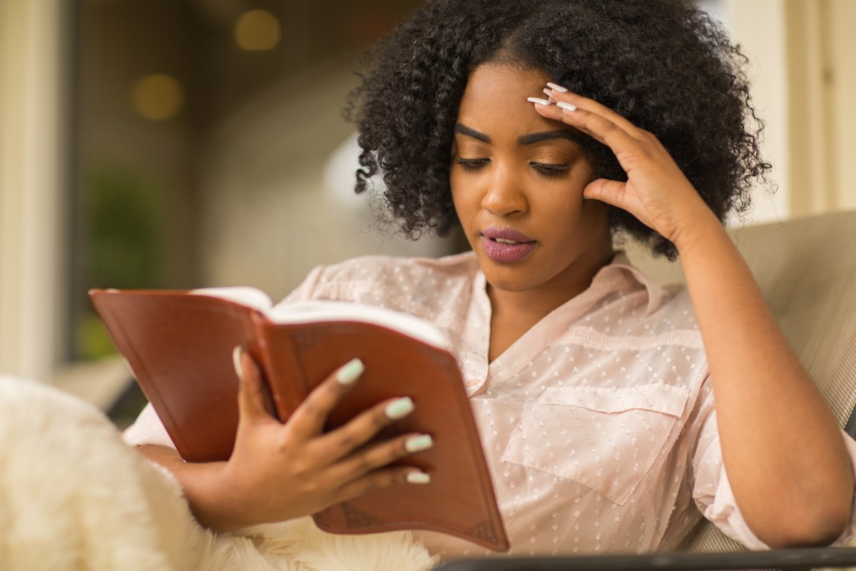 Black woman studying the Bible